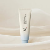 Skincare tube with gradient design on a soft beige background