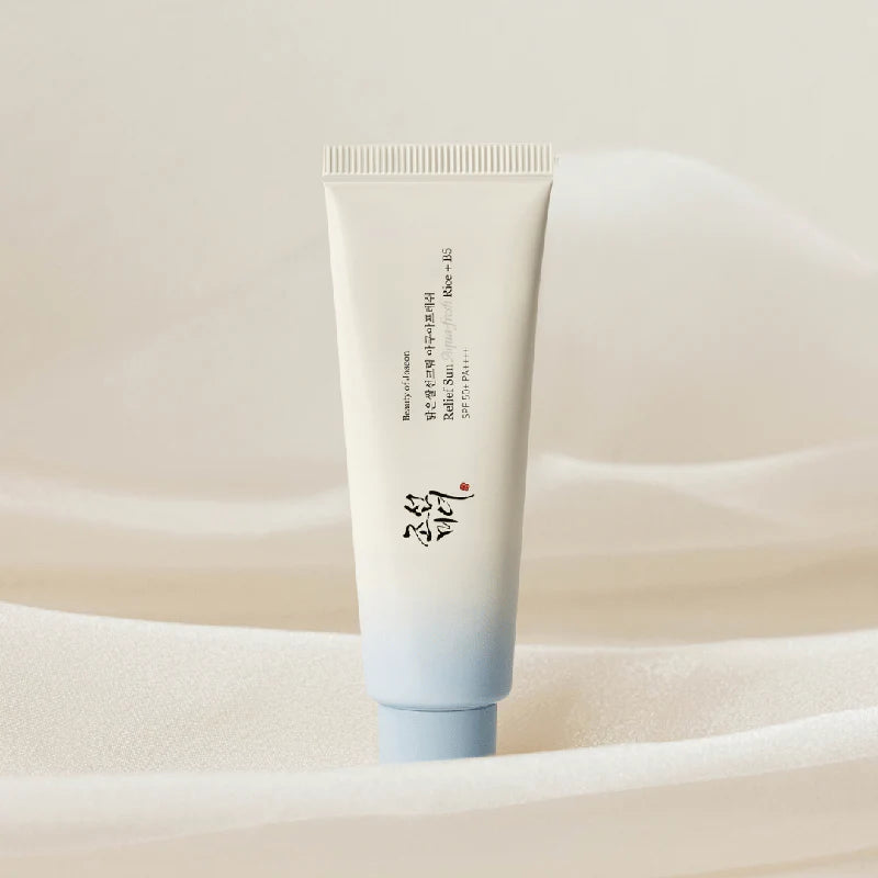 Skincare tube with gradient design on a soft beige background