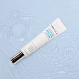 Brucke eye cream tube on a textured light blue background